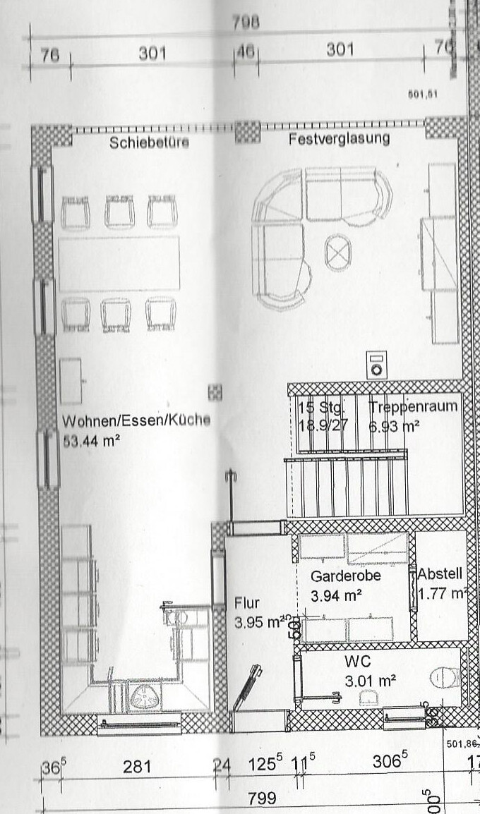 2D floor plan of an open living/dining/kitchen area with hallway and staircase space