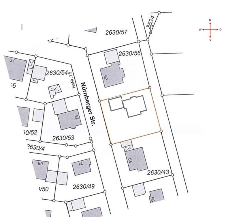 Site plan of a property showing plots, road layout, and building areas.