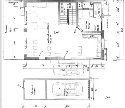 Floor plan of a house with terrace, garage, and living and dining areas