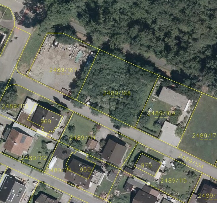 Aerial view of the parcels with yellow marked boundaries and buildings