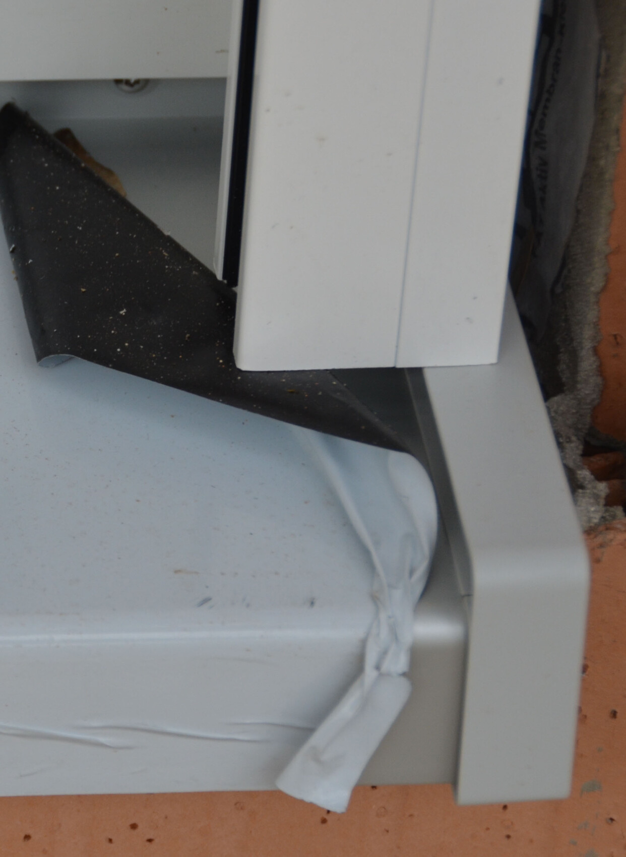 Exterior construction window frame with sealing tape and foil