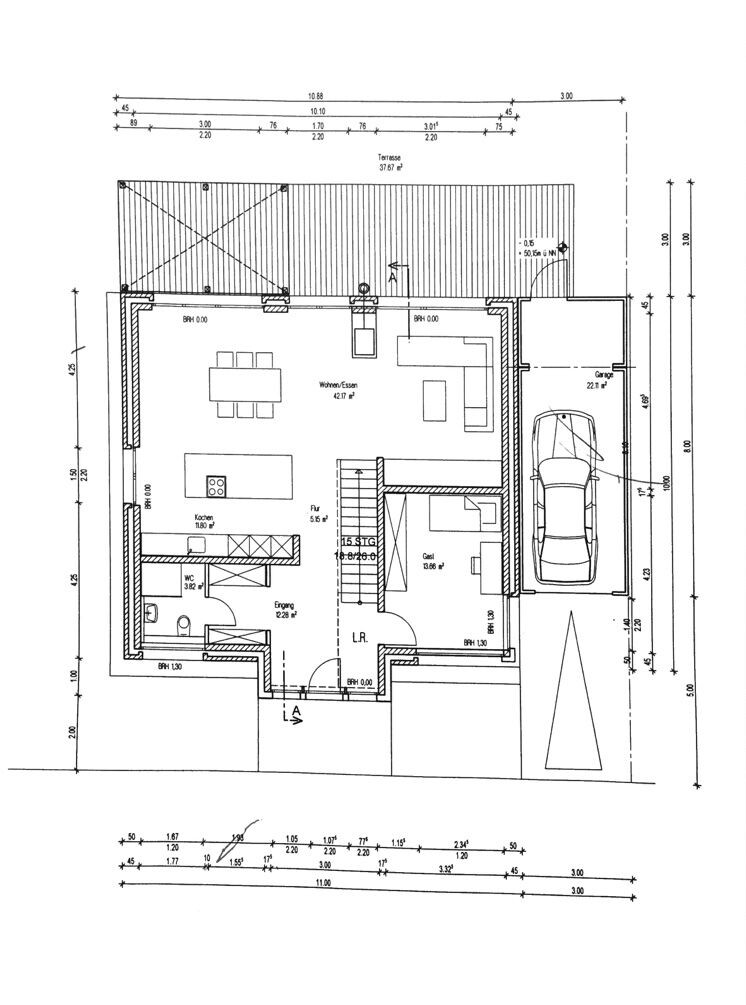 Floor plan of a house with living area, kitchen, garage, and stairs