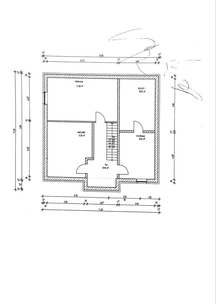 Floor plan of a house with staircase, hallway, and several rooms
