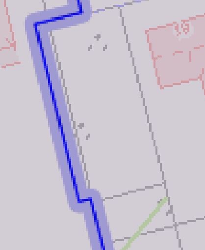 Schematic floor plan: long grey rectangle with blue border and green diagonal.