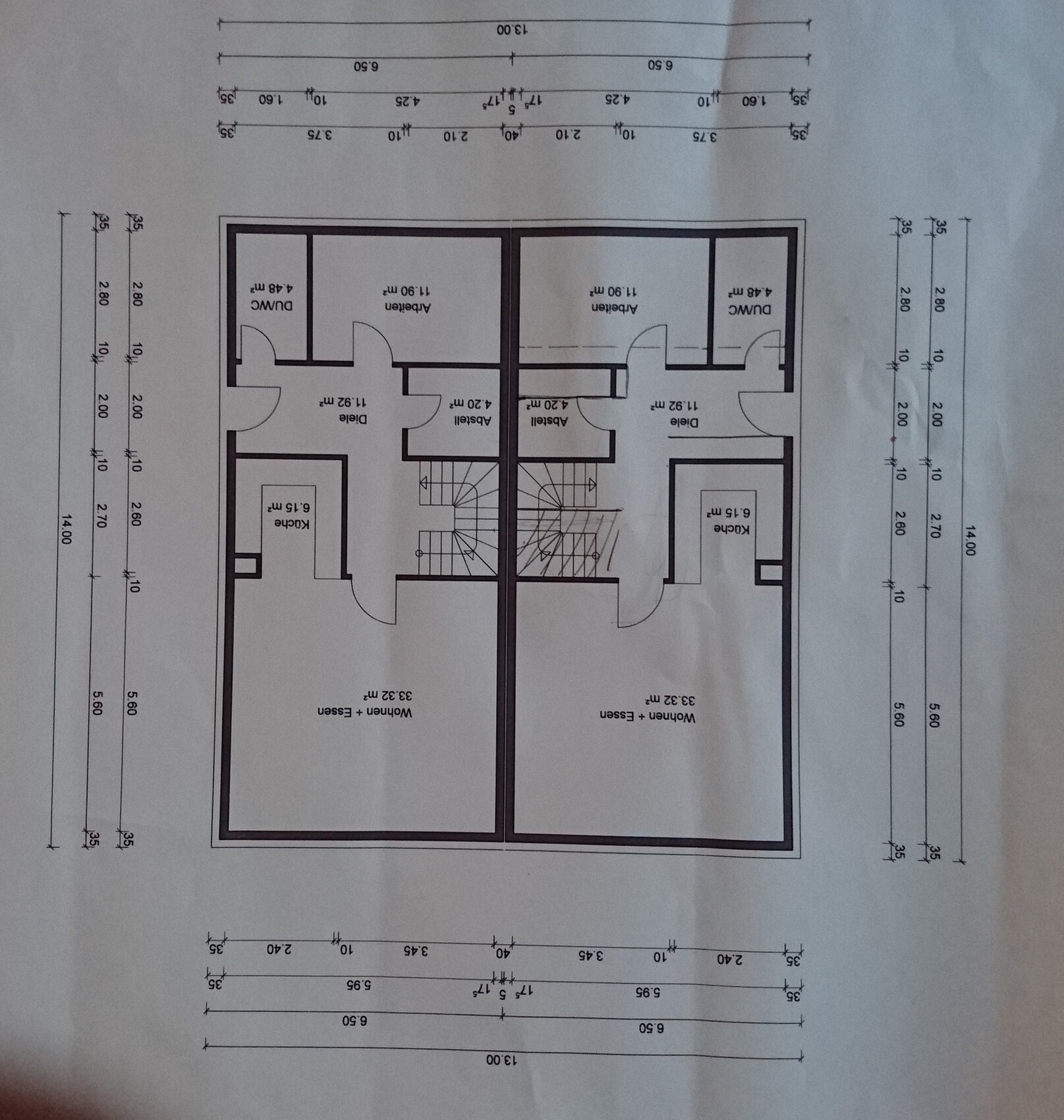 Two-family house floor plan with staircase, rooms, kitchen, and living area