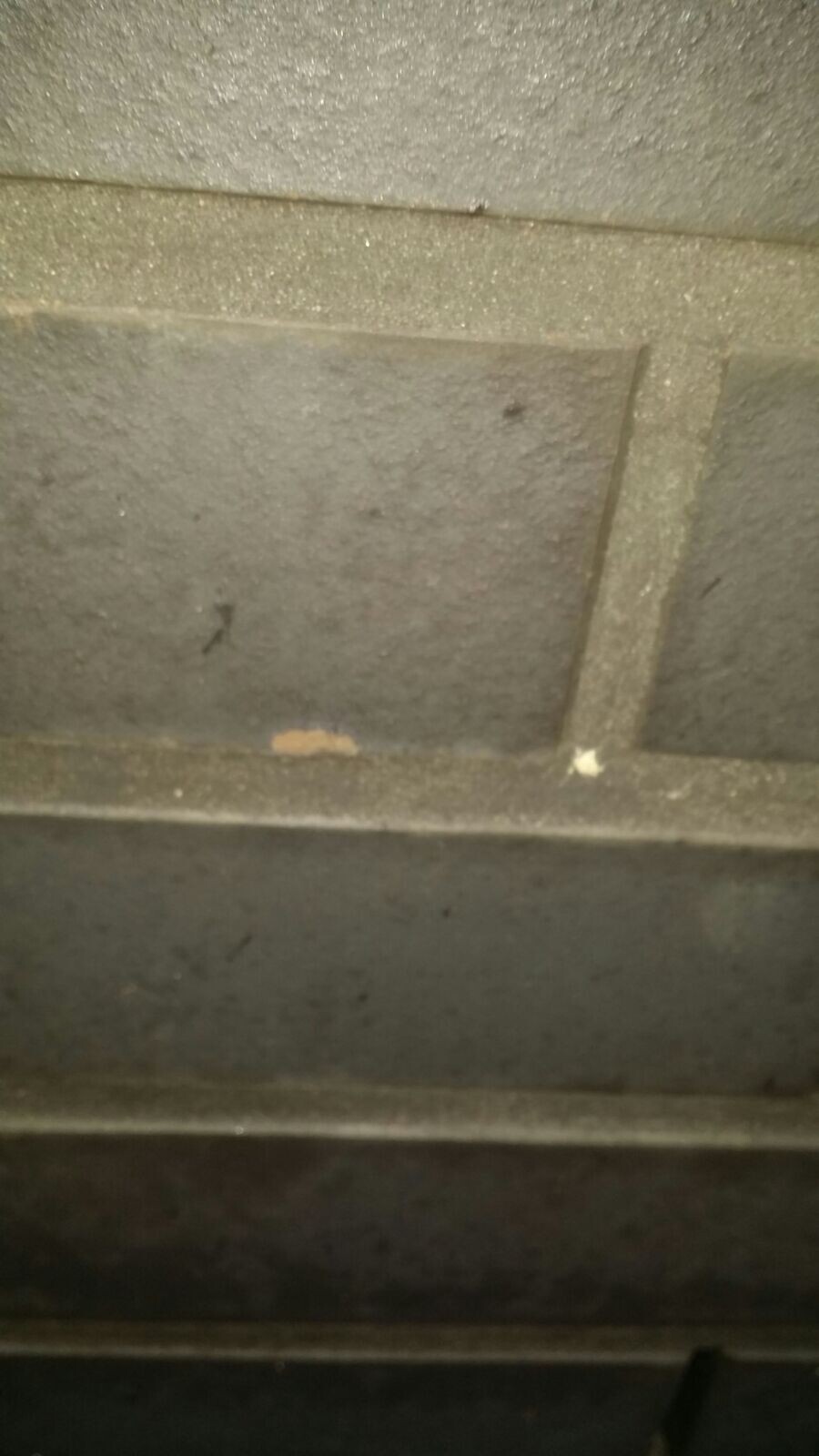 Close-up of a metallic air duct inside with a rough surface