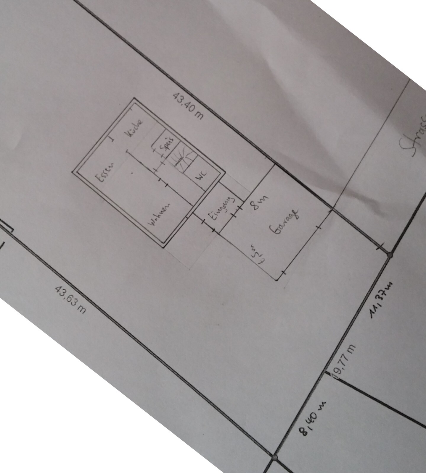 Floor plan of a house with kitchen, living room, dining area, hallway, and bathroom