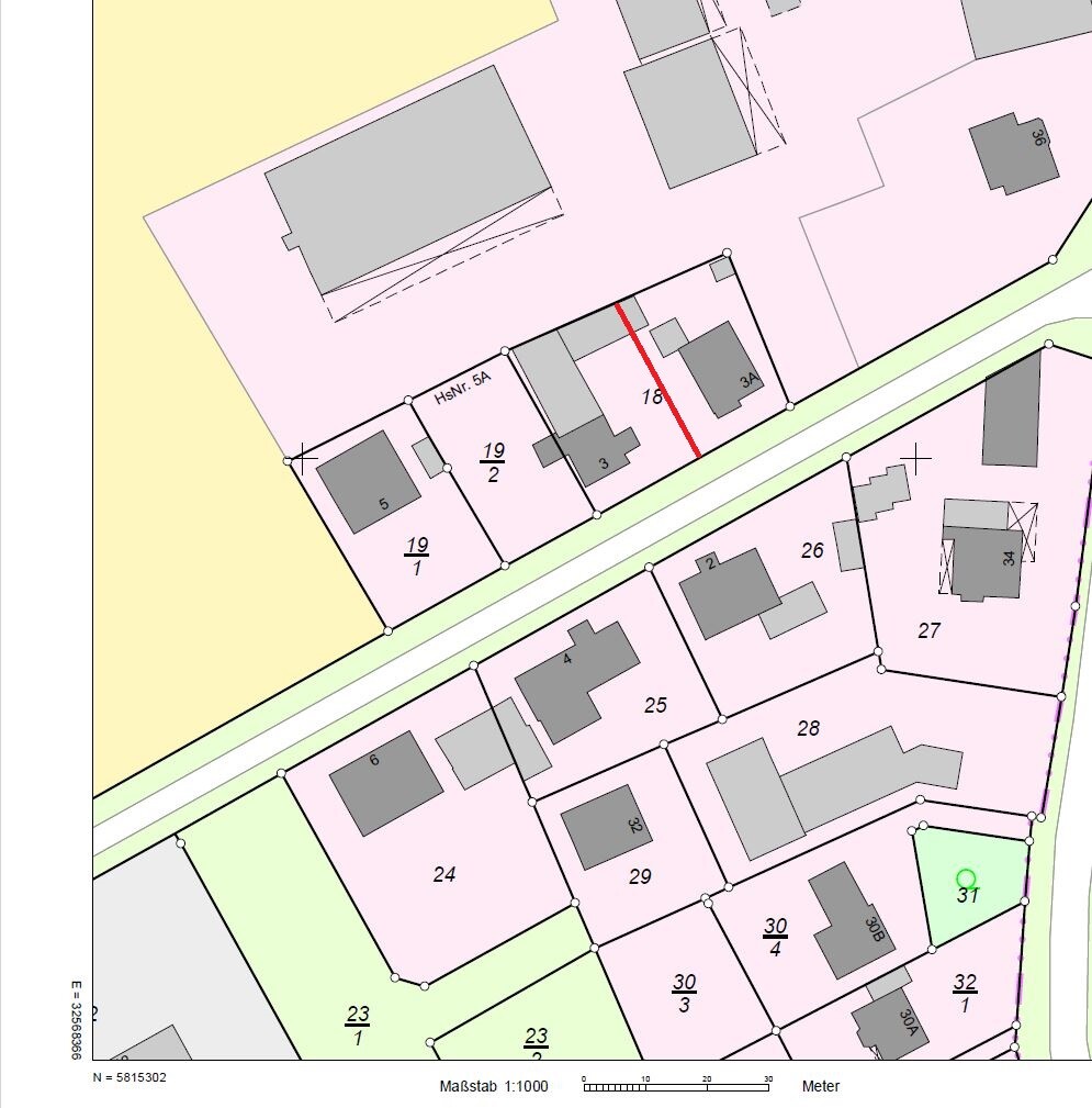 Site plan of a residential area with numbered plots, street layout and buildings
