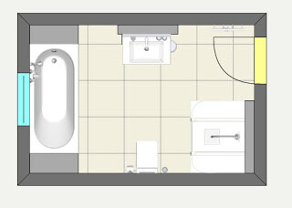 Bathroom floor plan with bathtub, sink, toilet, and door in a rectangular layout
