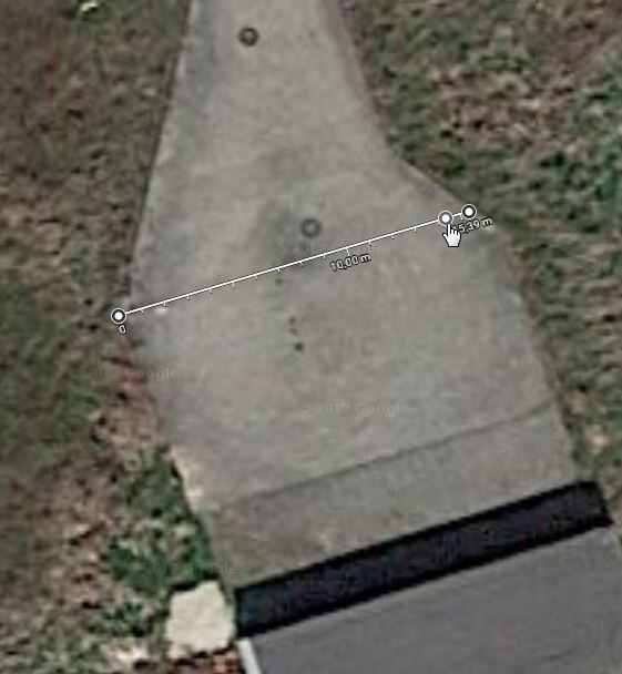 Outdoor area: Concrete path in the garden with 10-meter measuring line