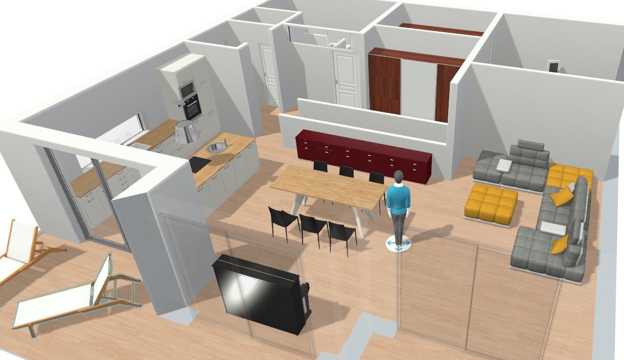 Open-plan kitchen with dining table, kitchen units, living area, TV, and person in the center.