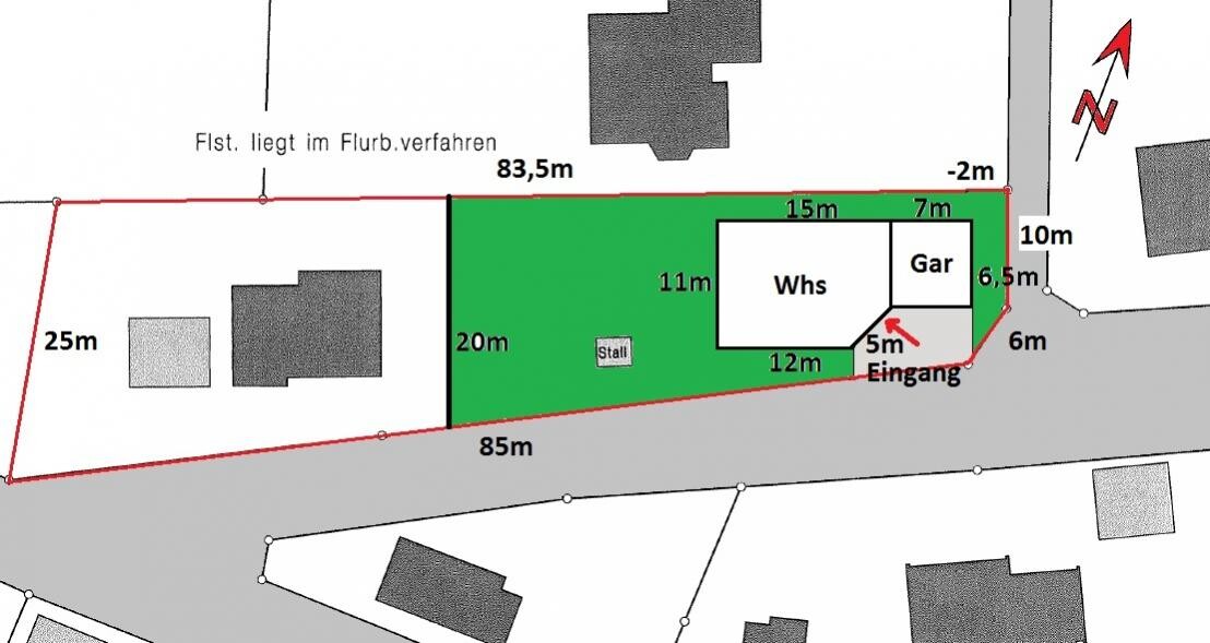 Site plan of a property with buildings, driveway, and property boundaries