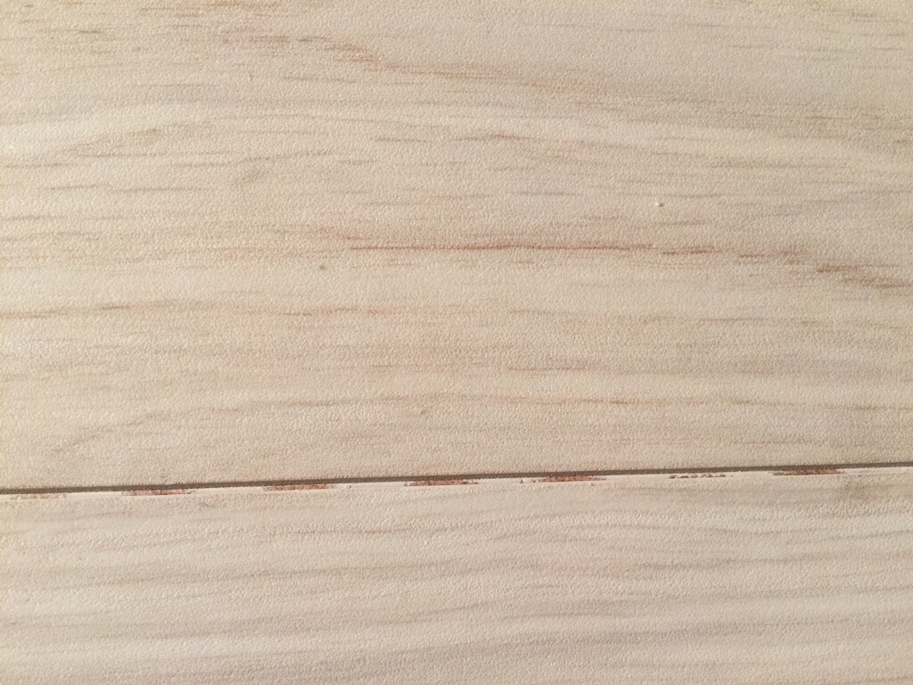 Close-up of light wooden floorboards made of wooden planks