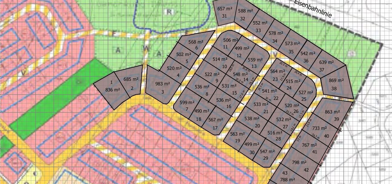 Site plan of a housing development with plots, roads, and green spaces.
