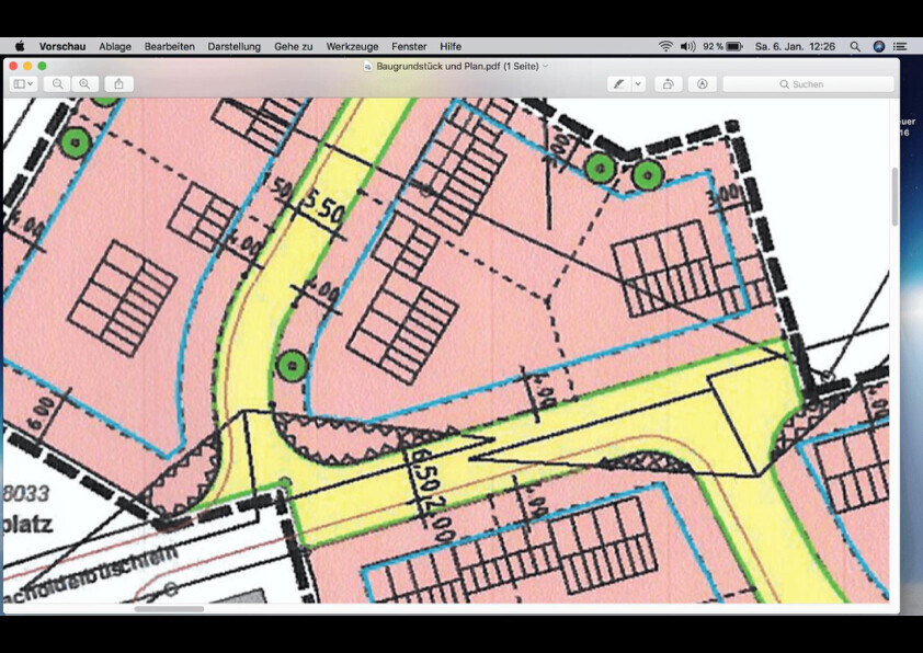 Site plan of a building plot with streets, colored areas and property markings