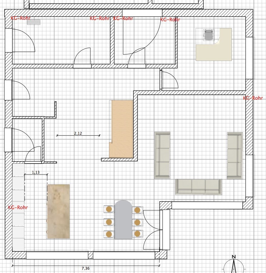 Open floor plan of living and dining area with kitchen island, dining table, and sofa lounge.