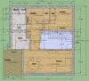 2D floor plan of a house with several rooms, orange-highlighted areas, green border