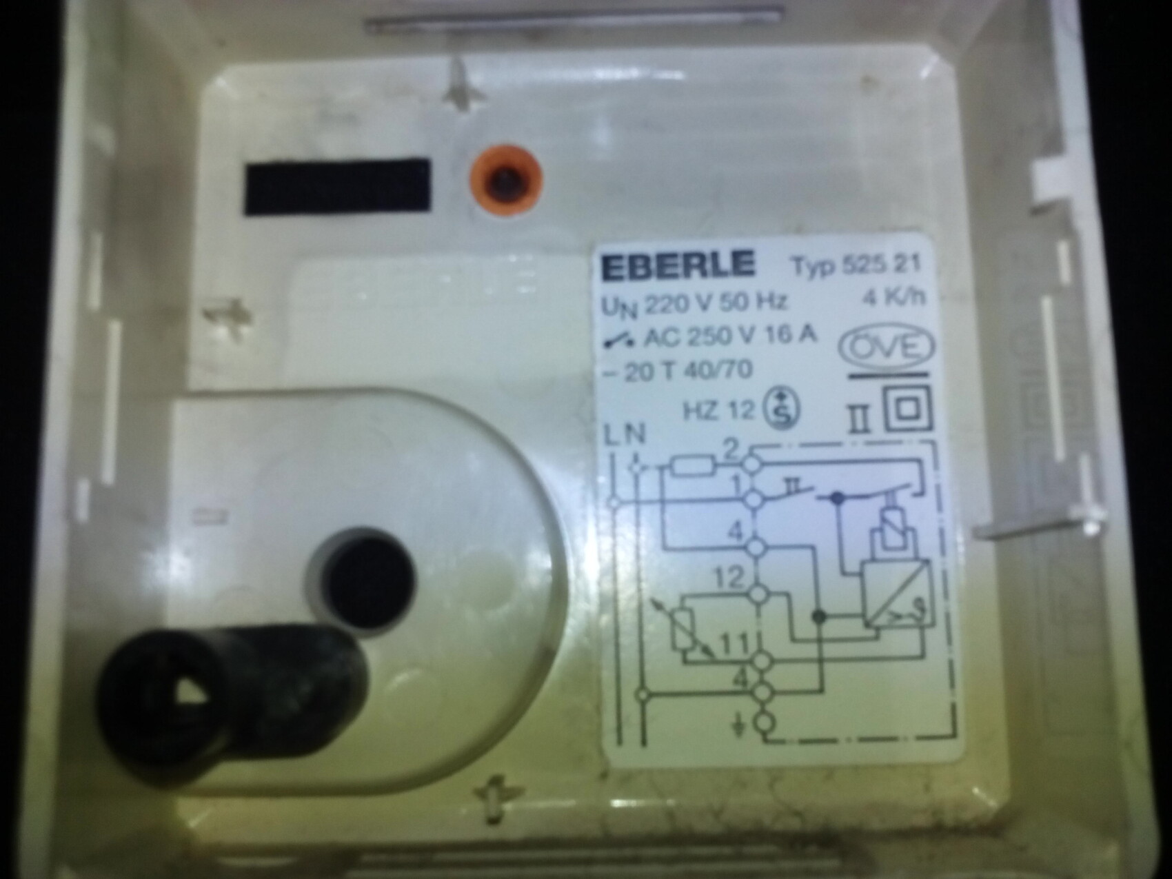 Close-up of an Eberle time relay in a plastic housing with wiring diagram