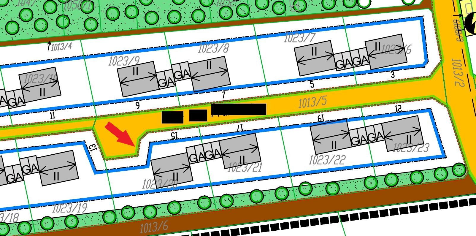 Site plan of a building area with plots, road layout and green spaces.