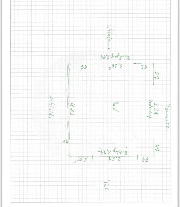 Hand-drawn floor plan sketch of a house on graph paper with room layout