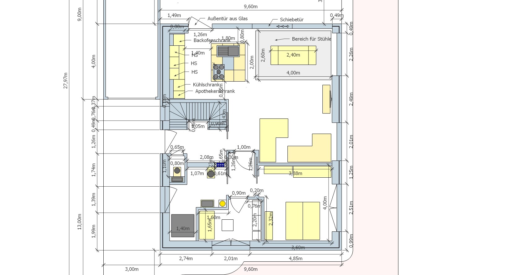 Floor plan of a living and kitchen area: open kitchen with island, dining nook, living room, staircase.