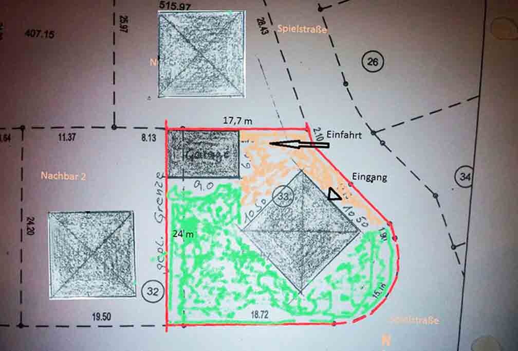 Site plan of a plot with buildings, access roads, entrances, and garden areas