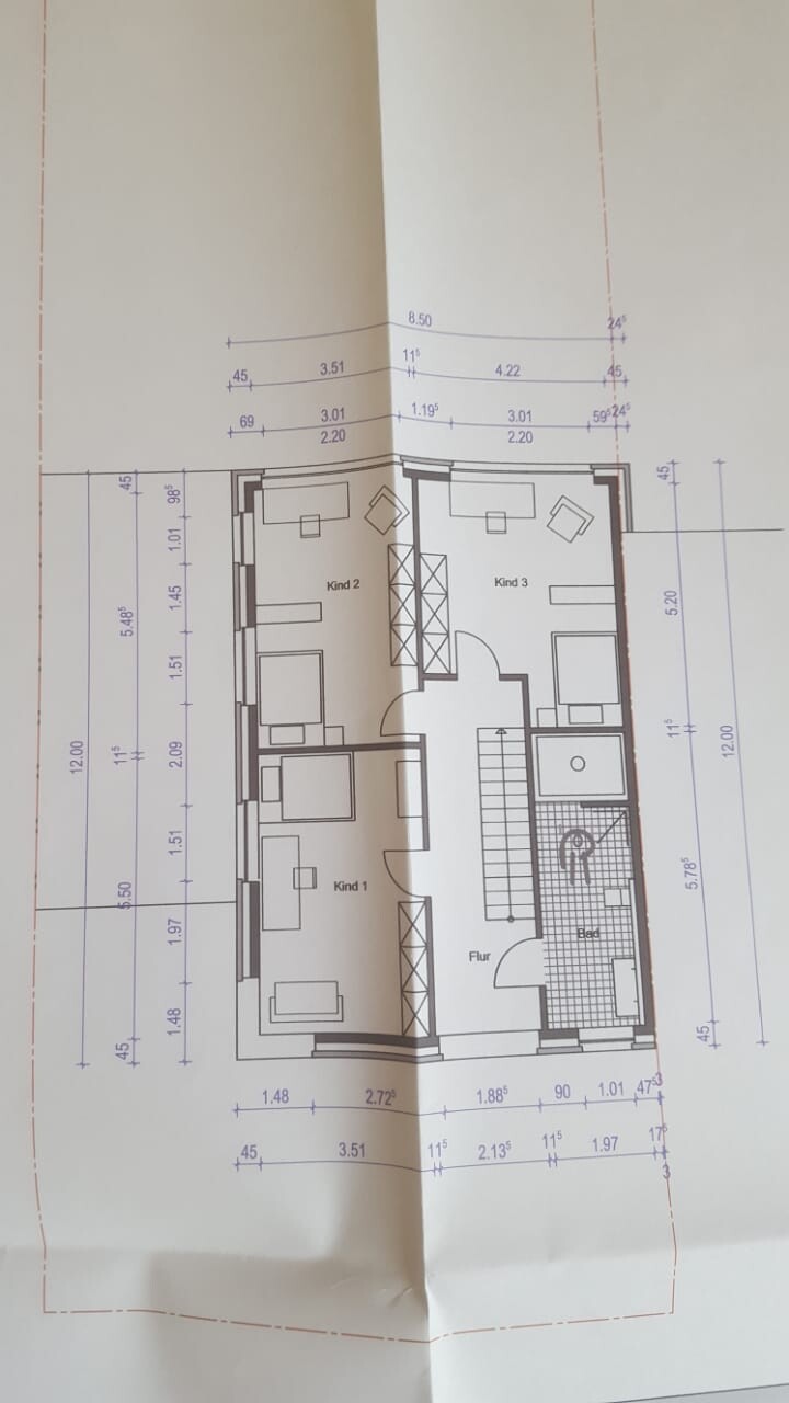 Floor plan of a house with several rooms, hallway, and stairs on plan drawing