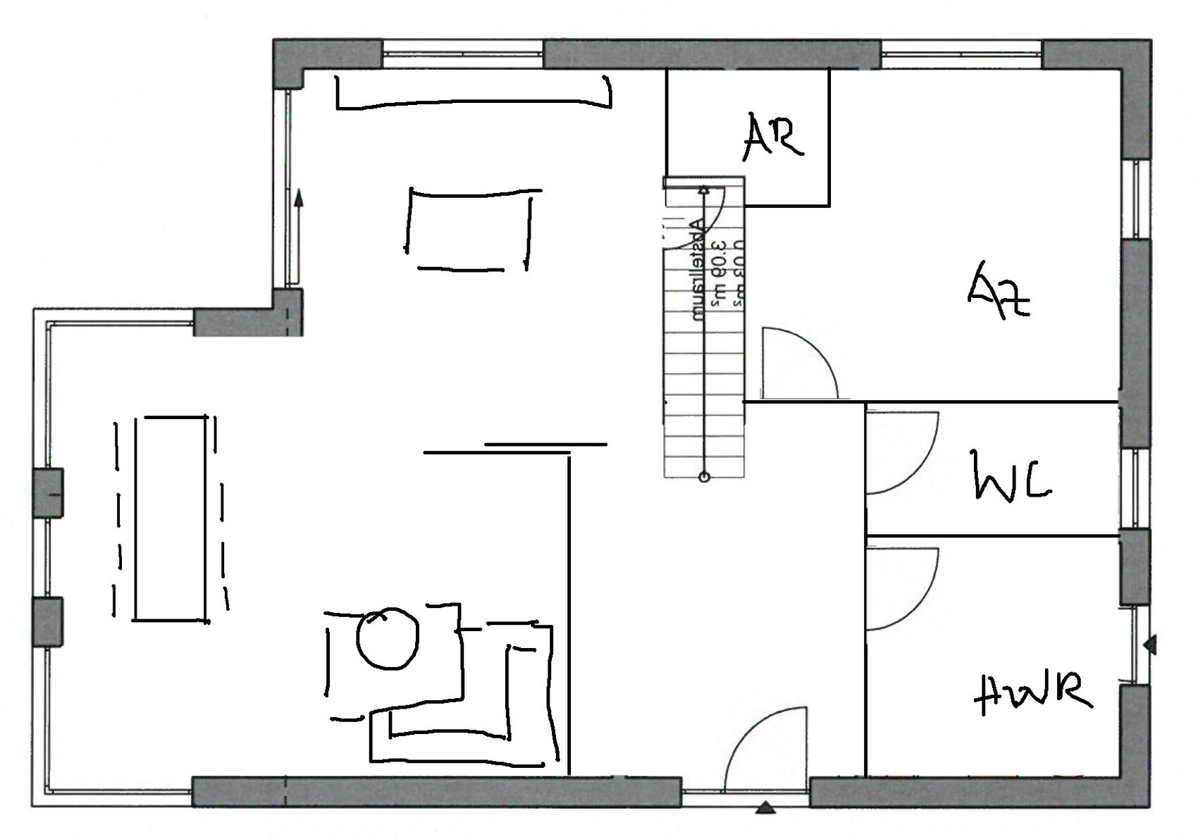 Floor plan of a house: living room on the left, central staircase, two rooms on the right (A2); WC and utility room.