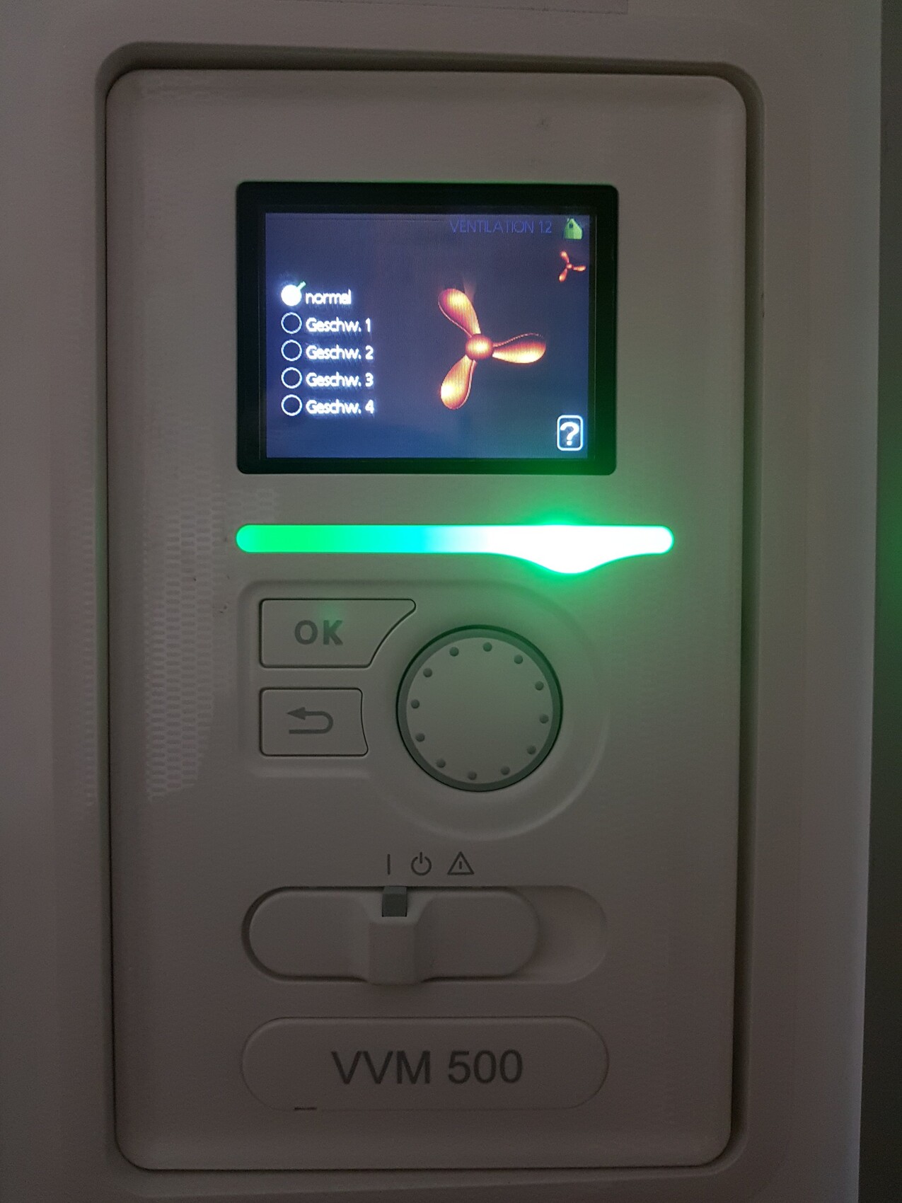 Close-up of a VVM 500 ventilation unit with display and green light strip