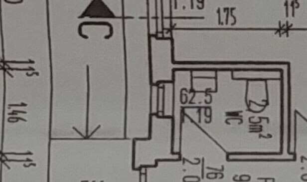 Detailed floor plan of a building with walls, doors, and dimensions.