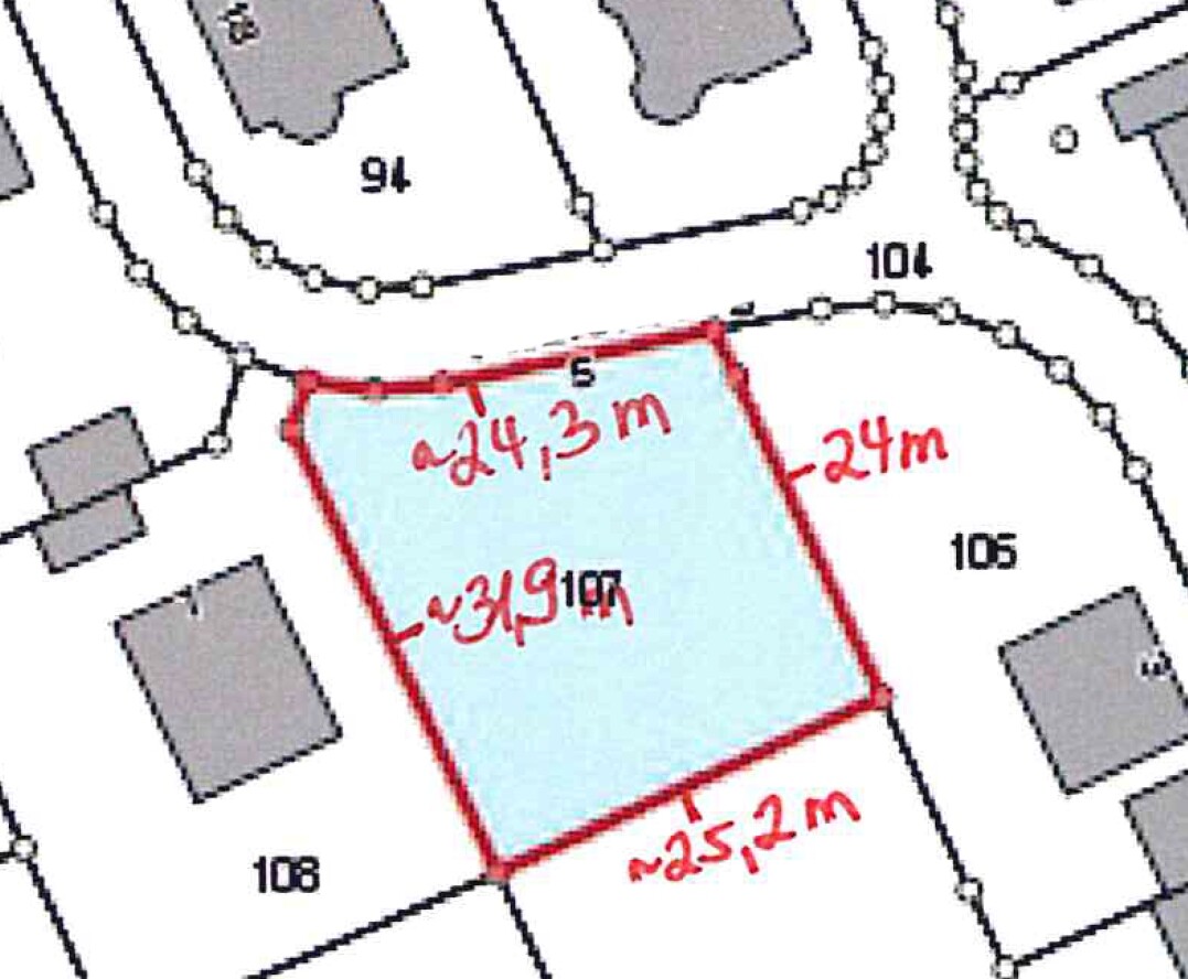 Site plan of a building plot with red outline and blue area