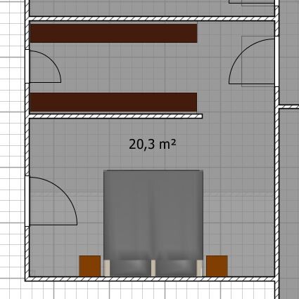 Floor plan of a bedroom with bed, two nightstands, and wardrobes