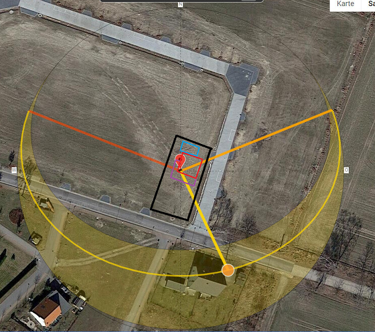 Aerial image of a building complex with red pin, black rectangle, yellow circle, and orange lines