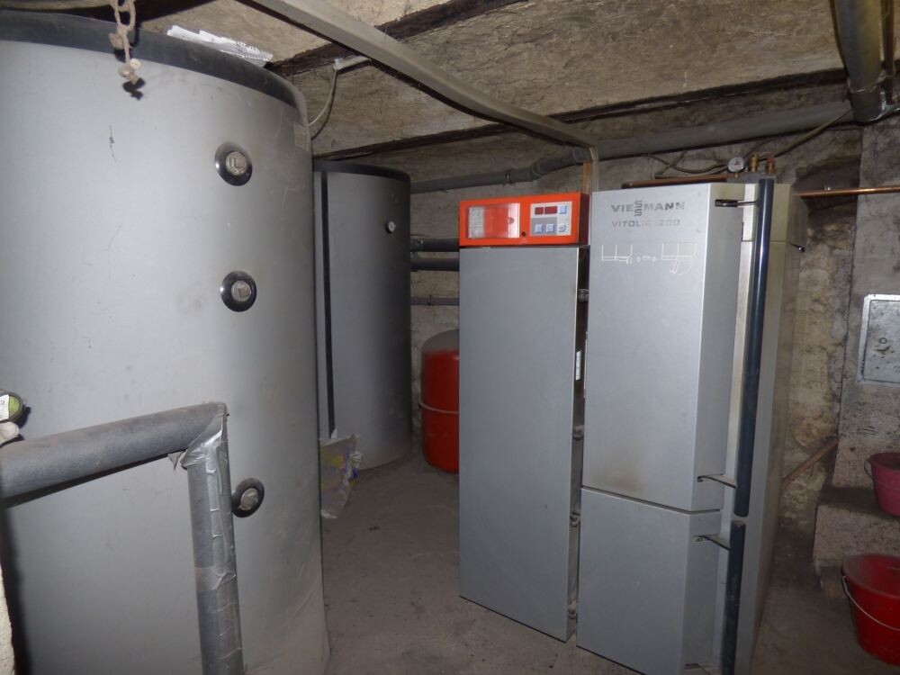 Basement with heating system, hot water tank and home technology
