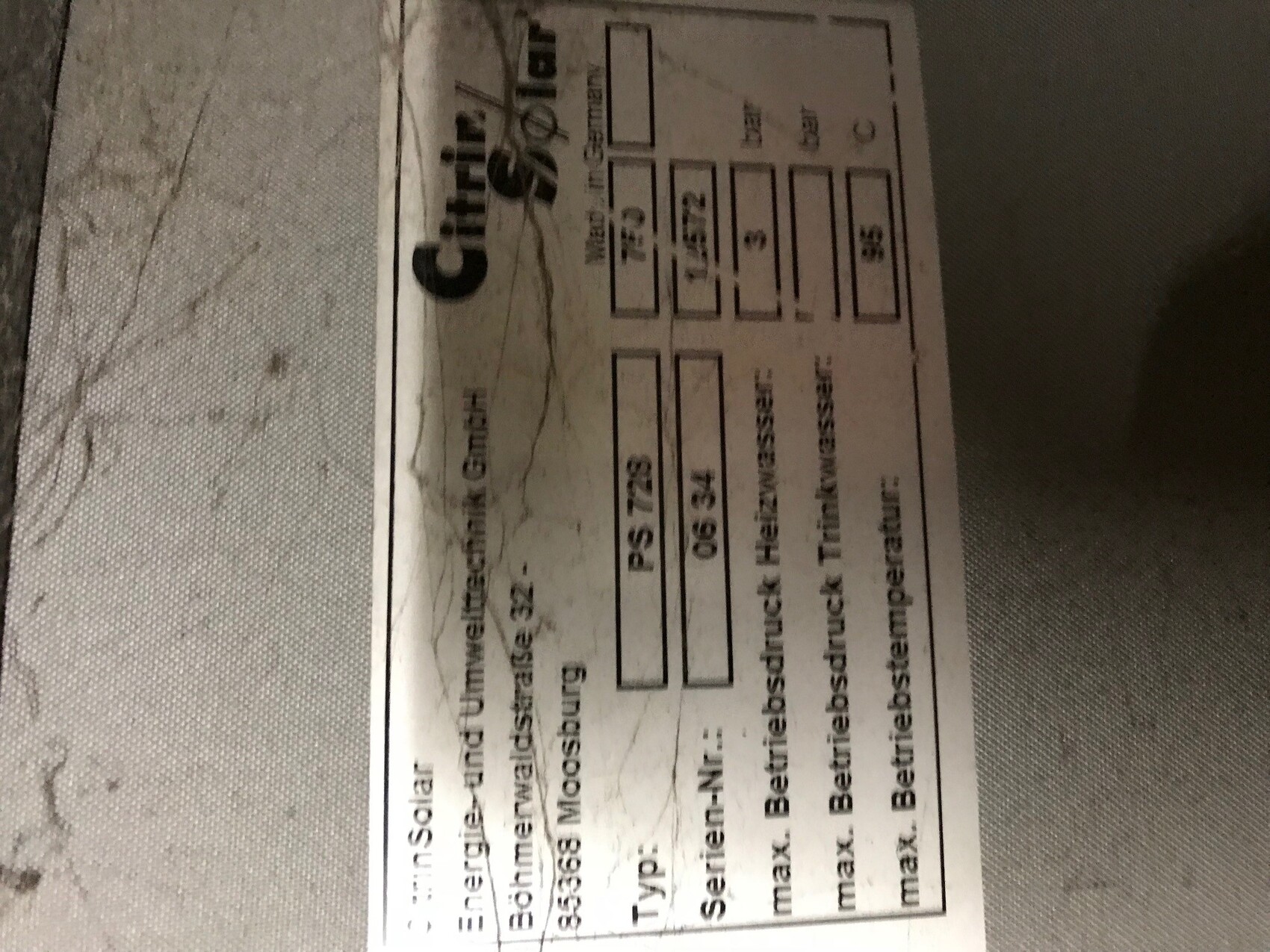 Printed construction plan document with tables and labels
