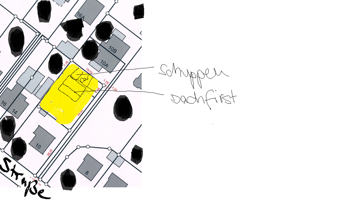 Site plan of the building plot with building area marked in yellow and notes on the edges.