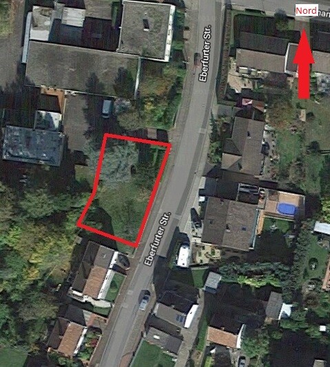 Aerial photo of a building plot outlined in red on Eberfurter Street, surrounded by residential houses
