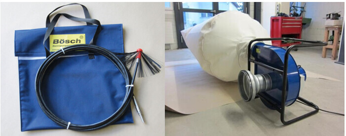 Left: blue tool bag with coiled cable; right: paper roll and cable spool.
