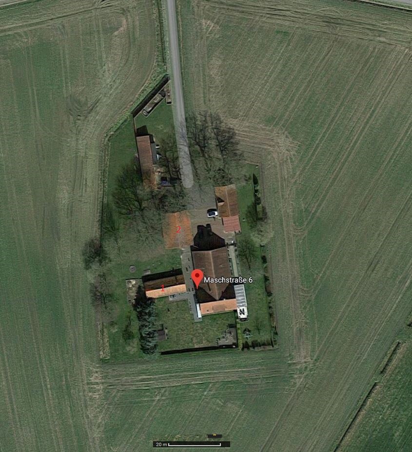 Aerial view of a farmstead with house, courtyard, and garden at Maschstraße 6