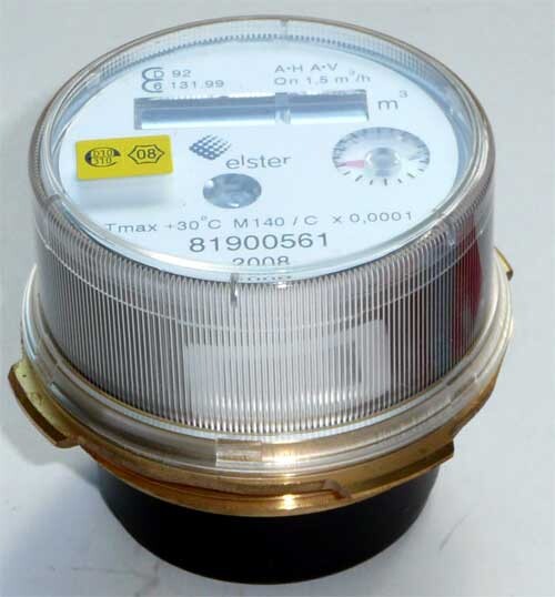 Round electricity meter with glass cover and dial, Elster logo visible