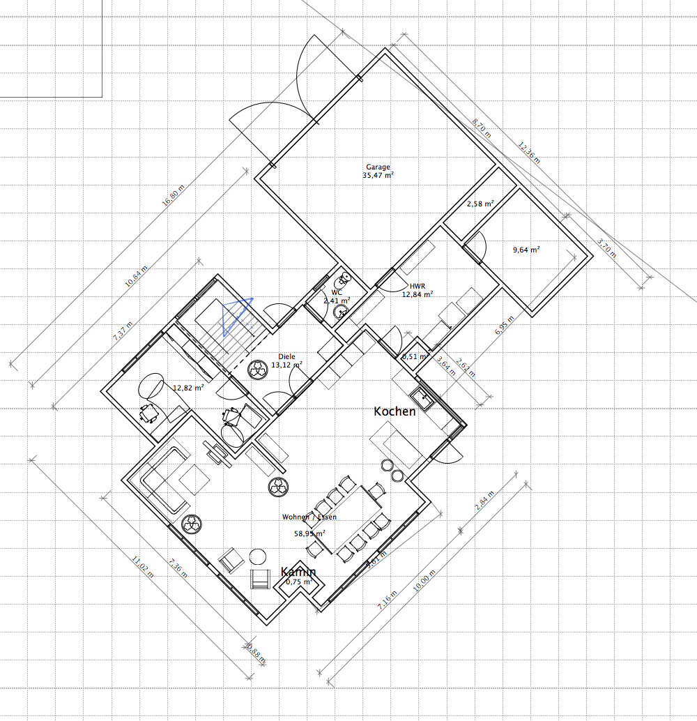 Floor plan of a house showing kitchen, living/dining area, fireplace, entrance hall, garage, utility room