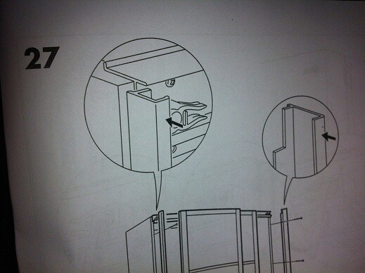 Step 27: A component is slid into the frame; arrows show orientation.