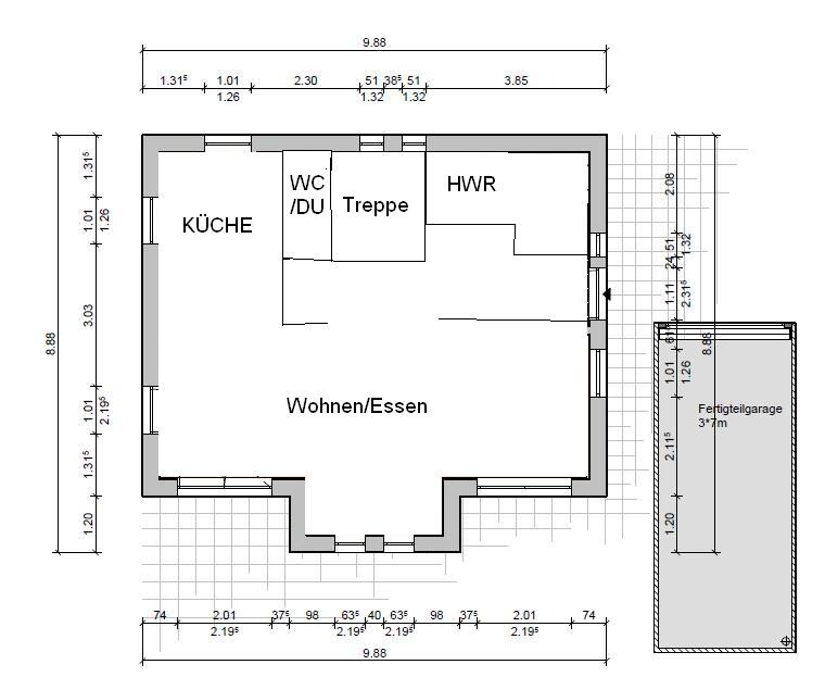 Floor plan of a house: open living/dining with kitchen, WC/shower, staircase, utility room, and garage.