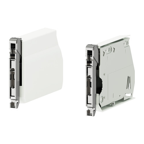 Front and back view of a white, modular electrical module.