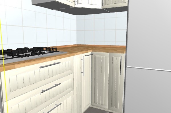 Kitchen with white cabinets, wooden countertop, gas stove on the left, corner cabinet, refrigerator on the right.