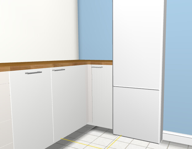 Kitchen: white base cabinets, wood countertop, light blue walls, floor tiles, refrigerator on the right.