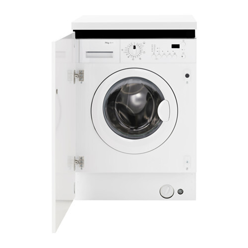White front-loading washing machine with round door, detergent drawer top left.