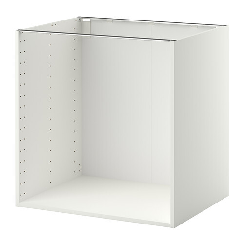 White open kitchen base cabinet, sides with rows of holes for adjustable shelves.