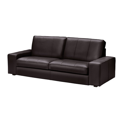 Dark brown leather sofa in the living room with three seats