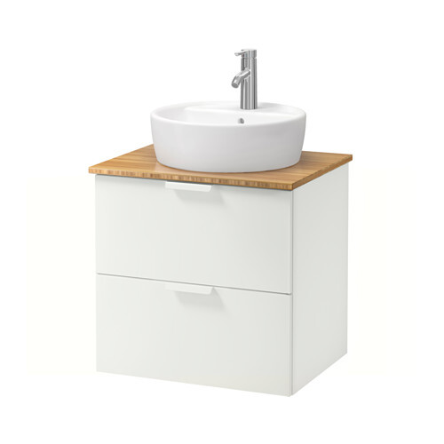 Washbasin with wooden countertop, white base cabinet, and round basin with faucet.